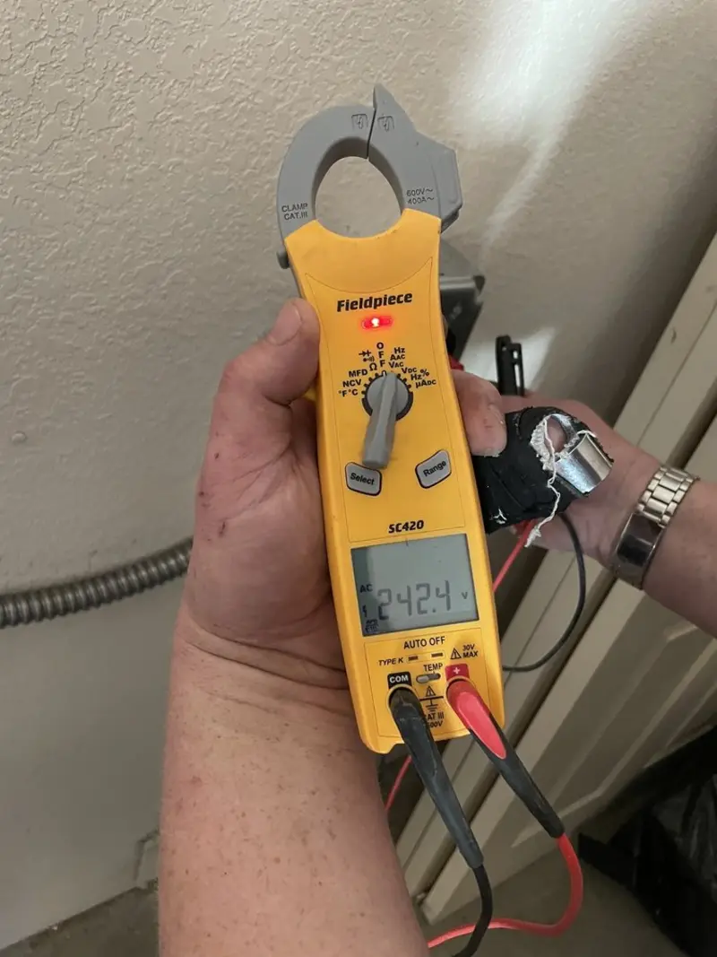 Voltage testing with clamp meter during Ceiling Fan Installation in Olney
